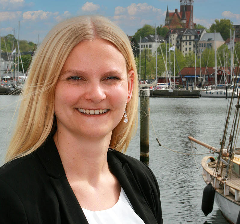 FRS employee standing infront of the flensburger fjord.