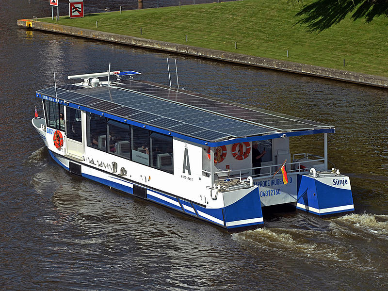 A solar-powered boat in the water.