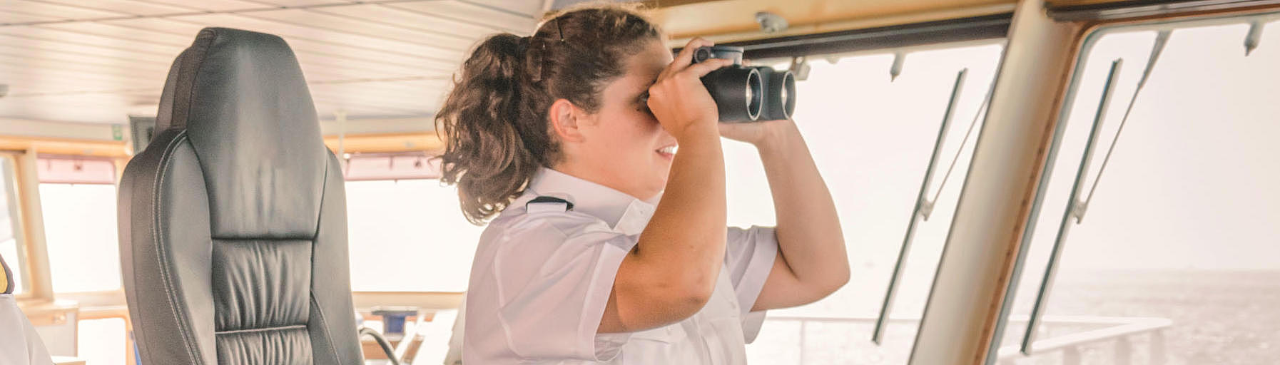 Male and female captain at the controls.