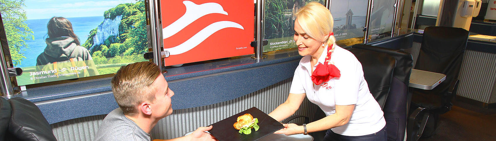 man getting served food on the "Skane Jet" 