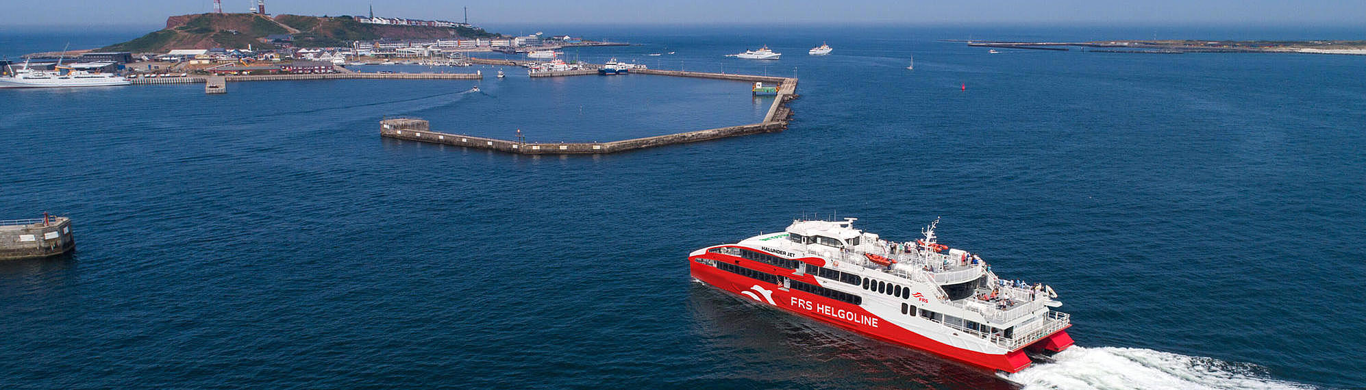 The high speed catamaran "Halunder Jet" arriving the port of Heligoland.