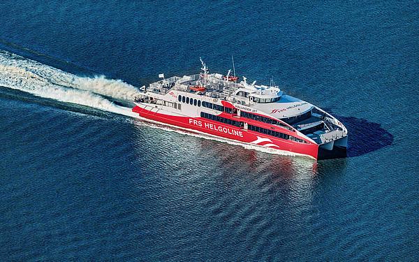 Vessel Halunder Jet sails through the sea.