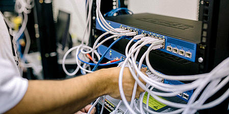 A man working on a server. 