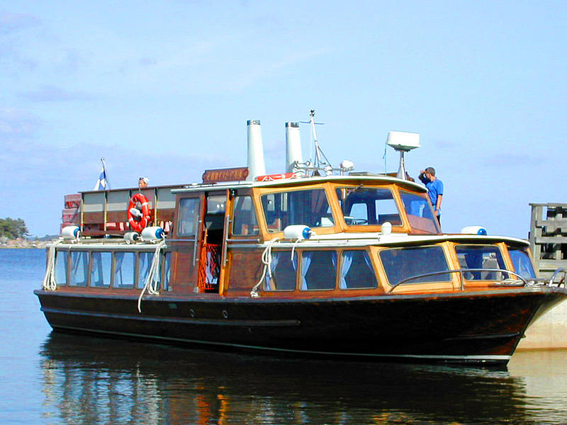 The wooden ferry "Tuulispää" with its large glass front.